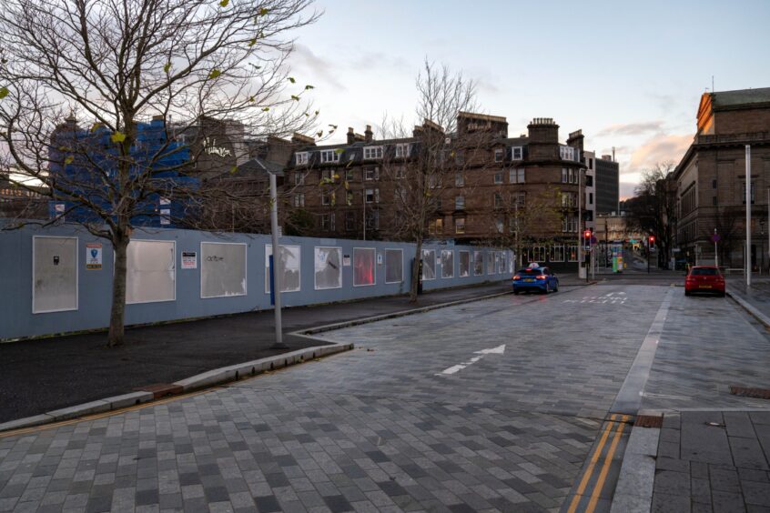 Hoardings along South Crichton Street. 