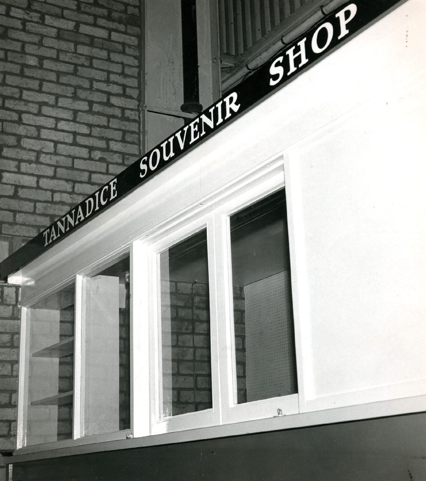 Dundee United's souvenir shop in the 1970s, showing a white building with four glass windows and Tannadice Souvenir Shop printed along the top.