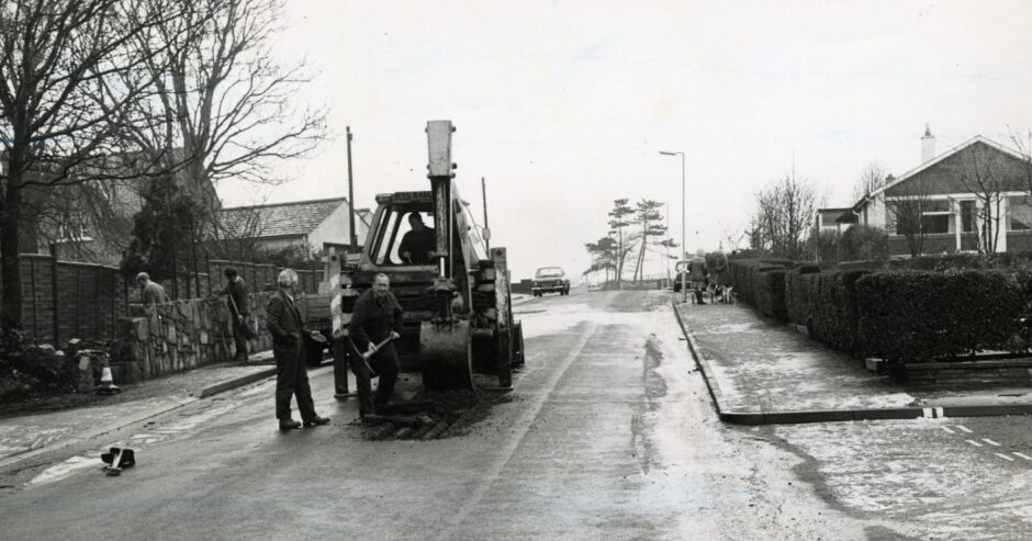 Workers on Grange Road in Monifieth. 