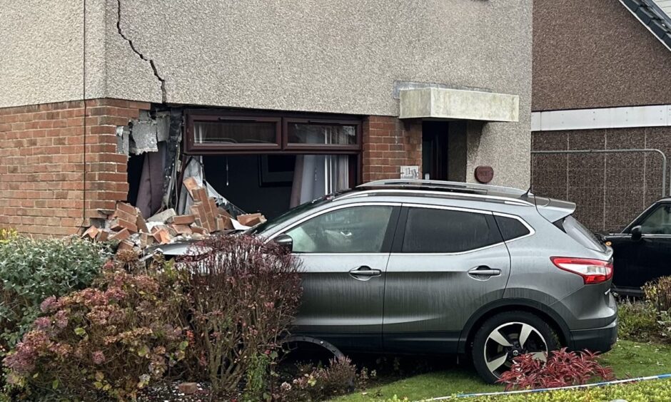 Emergency response after car crashes into house in Dalgety Bay