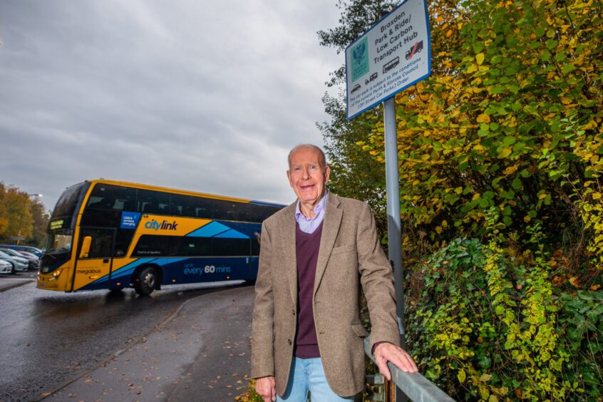 Willie Wilson at entrance to Broxden park and ride site with bus departing behind
