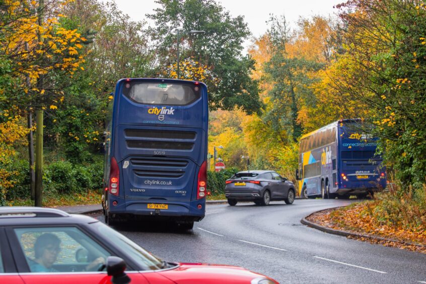 Buses and cars entering Broxden park and ride depot from Broxden Avenue