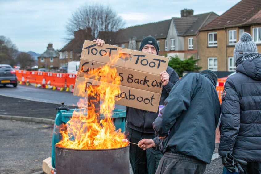 Protesters toast marshallows on their brazier
