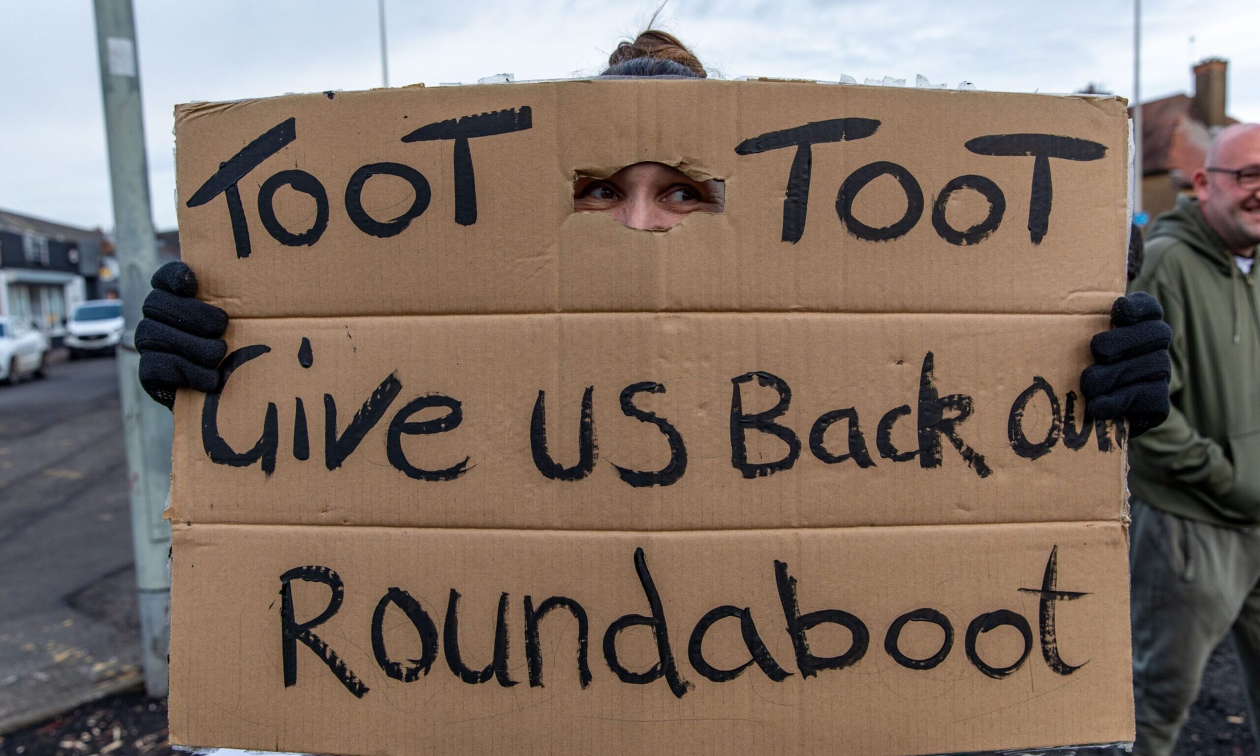 A protestor demands the return of the Toll Bar roundabout in Methil