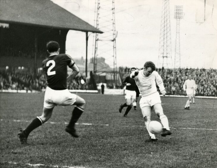 Action from the first leg against Leeds in May 1968 as Scotland star Billy Bremner fires in a shot under close attention from the Dundee defence.