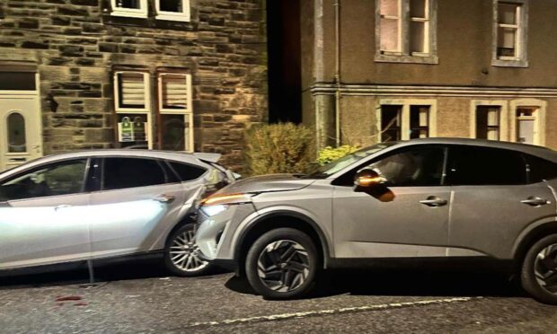Man and woman charged after car hits row of parked cars in Leslie