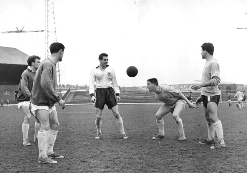 Alex Hamilton during a game of head tennis among Dundee FC players on the Dens Park pitch