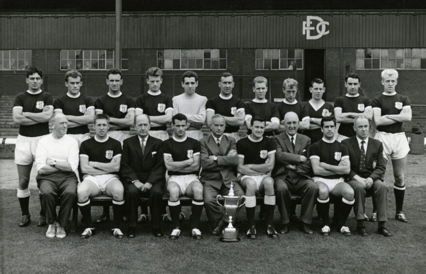 Dundee's greatest team lines up alongside manager Bob Shankly for a photo with the league trophy ahead of the new season.