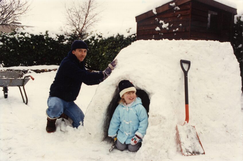 David Aitson and daughter Louise with their igloo. 
