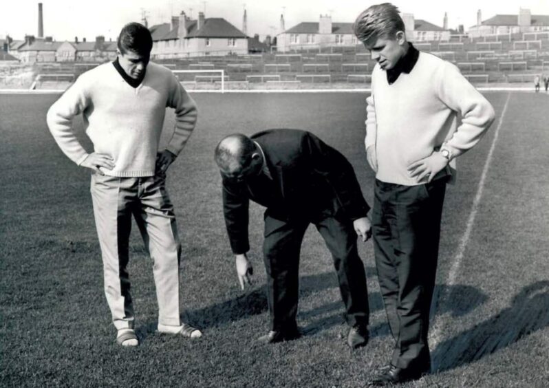Anton Regh, Zlatko Čajkovski and Karl-Heinz Ripkens inspect the Dens Park pitch.