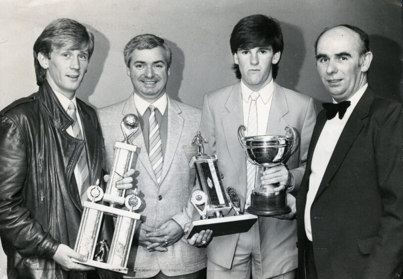 Dundee FC players Iain Ferguson and McKinlay hold their trophies after winning player of the year awards in April 1984.
