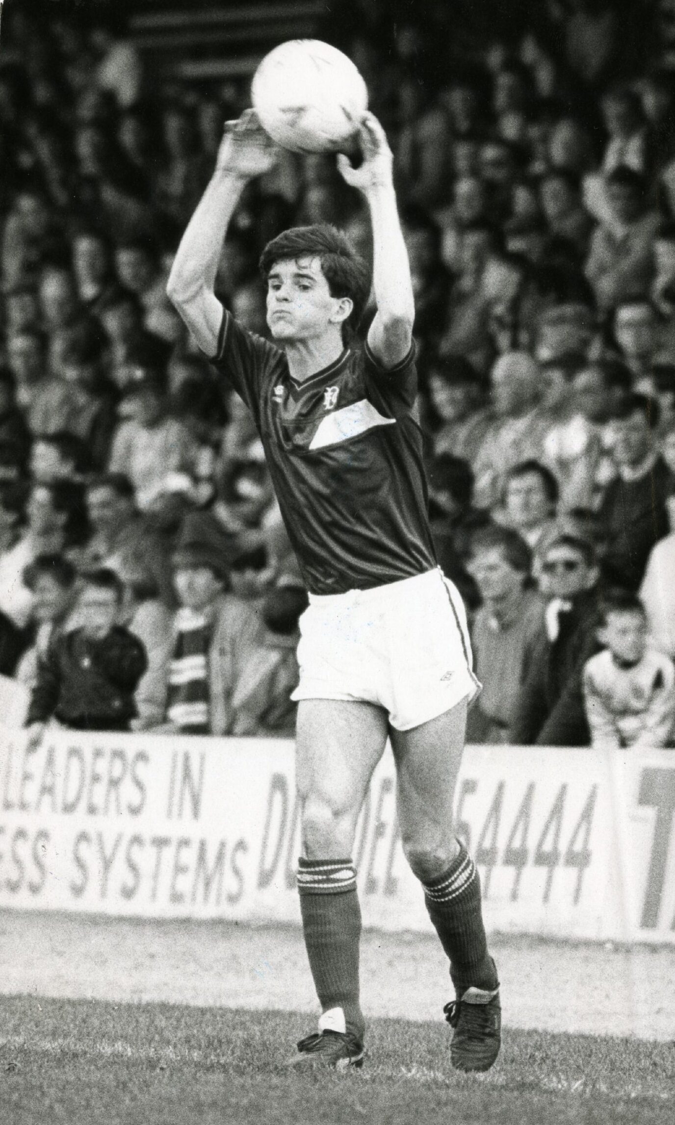 Tosh McKinlay takes a throw in while playing for Dundee FC