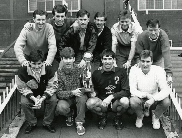 McKinlay and some Dundee FC team-mates with the trophy after winning the Tennent's Sixes