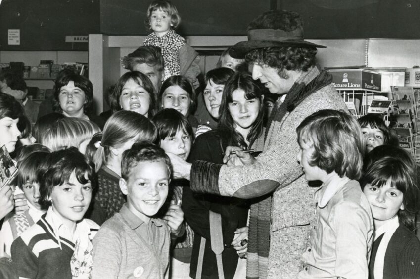 Tom Baker chatting with youngsters. I