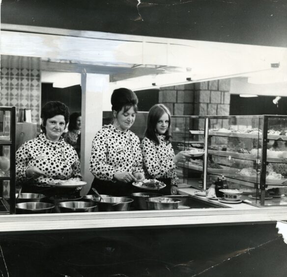 three female staff are seen preparing meals at the new self‑service counter