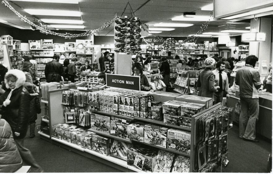 people browsing the well-stocked shelves of John Menzies