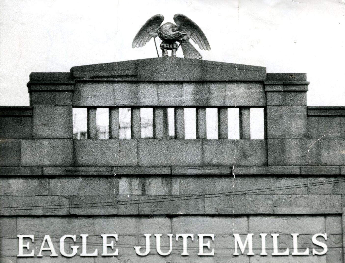 A wooden eagle on top of a building.