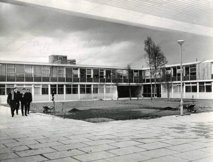 The inner court at Lawside Academy with four pupils walking across