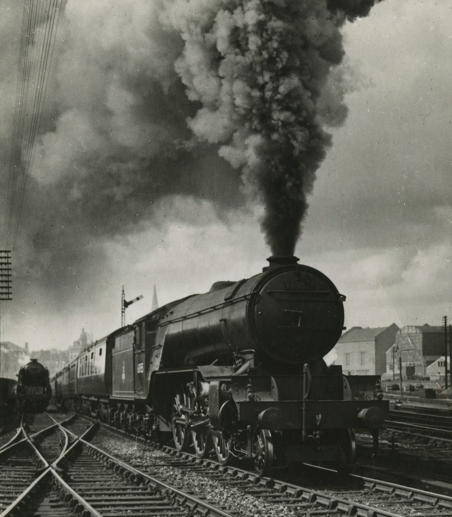 A train puffs towards a tunnel in Dundee.