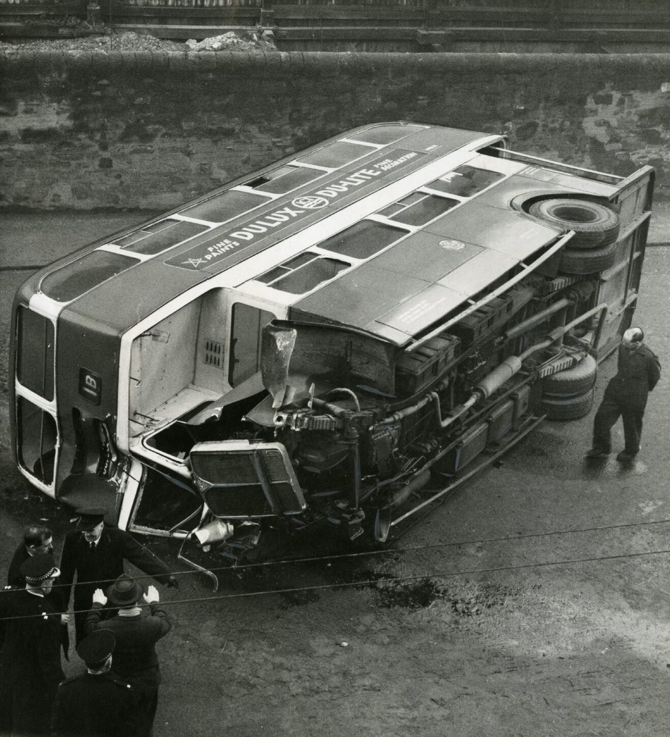  damaged bus lies on its side after a crash