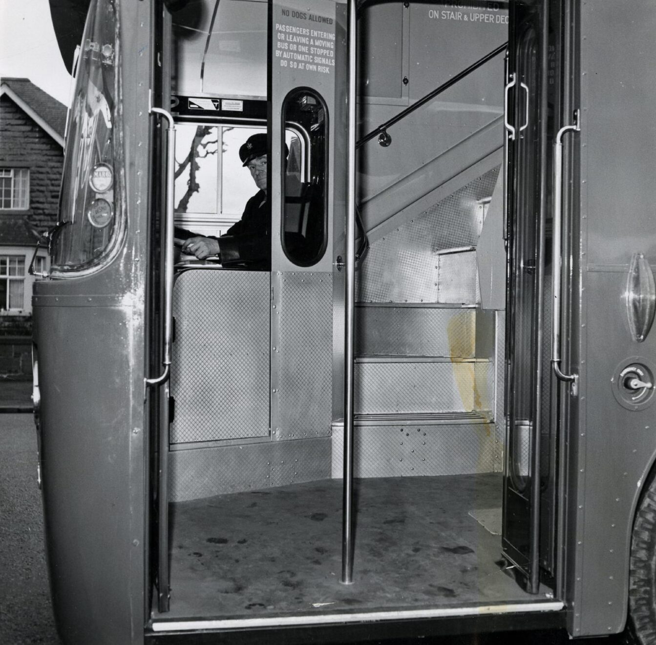 a driver looks out from inside a bus