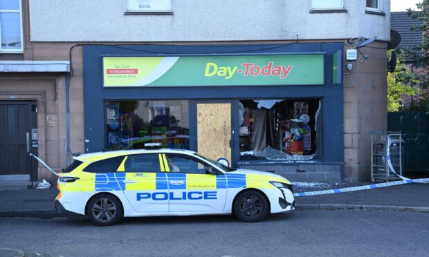 The Day-Today conveniece store in Perth has been taped off. Image: Stuart Cowper.