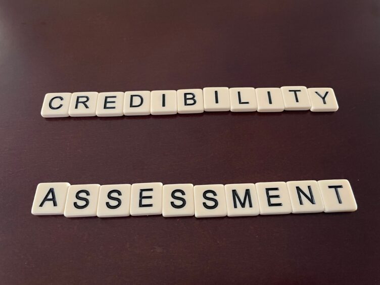 scrabble tiles that read 'credibility' and 'assessment'