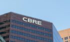 Close up of CBRE sign on a building.
