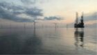 Oil rig and wind turbines in the North Sea.