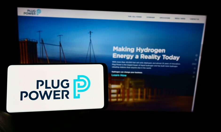 Logo of Plug Power, the company that will supply green hydrogen to Amazon, on screen.