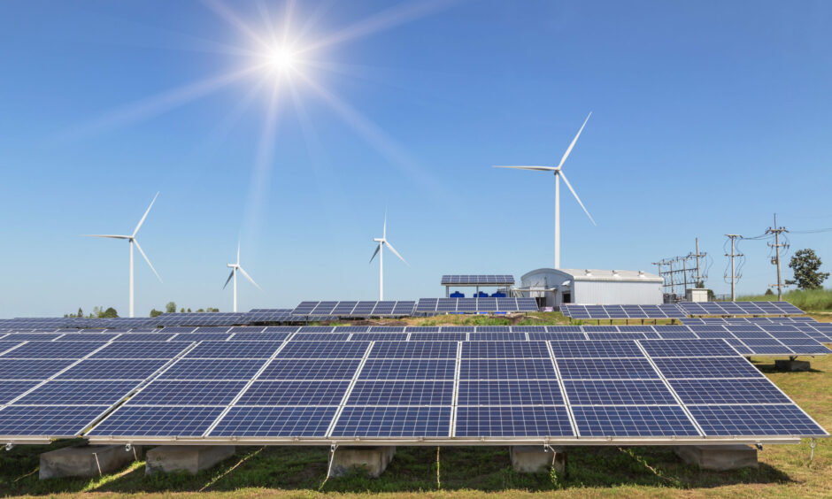 Renewables: solar panels and wind turbines.