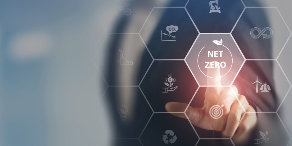 a person pressing a net zero button