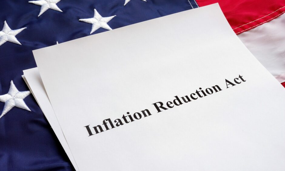 Inflation reduction act on a United States flag.