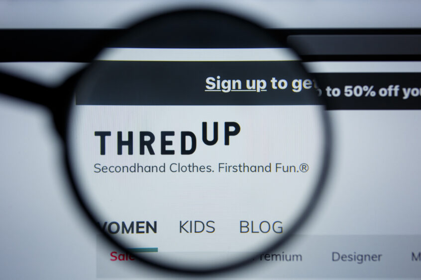 thredUP logo displayed on a desktop screen.