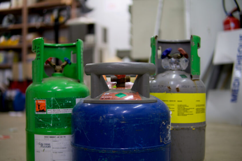 Cannisters of refrigerant gas.