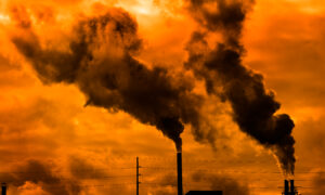 Industrial smoke stacks release emissions into the atmosphere.