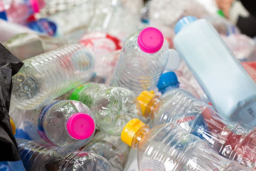 A pile of discarded plastic bottles.