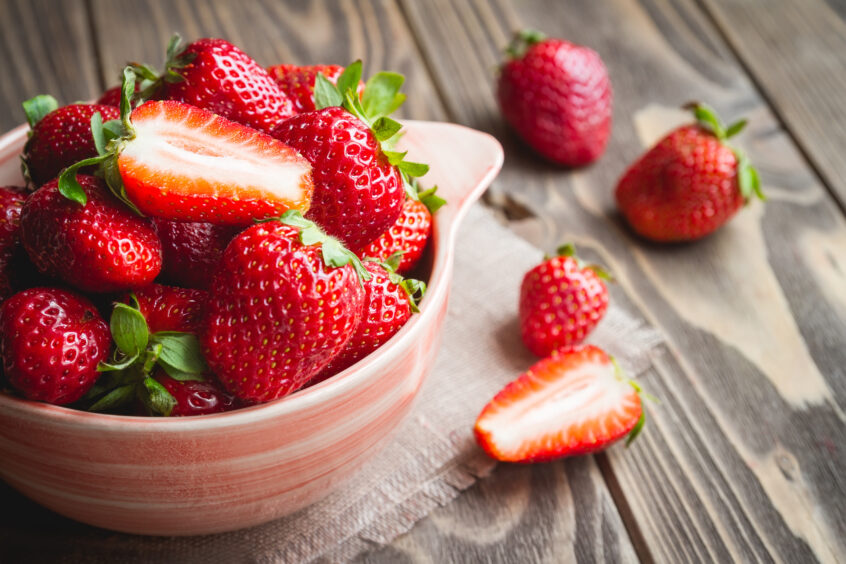 A bowl of fresh strawberries.