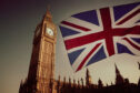 Union flag flying in front of Big Ben tower.