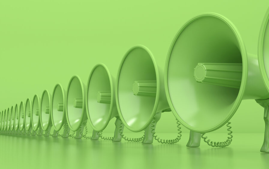 A row of green megaphones against a green background.