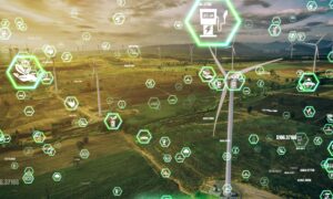 Conceptual image shows aerial view of agricultural fields and wind turbines, with floating icons representing disruptive technologies.