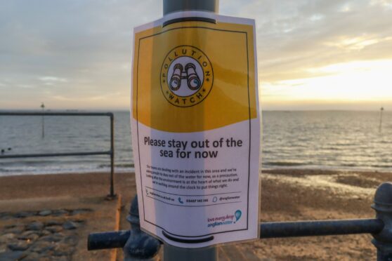 Warning signs along the seafront in Southend on Sea, advising people not to enter the water. Residents and visitors to the town on the river Thames estuary have been warned not to enter the water at three beaches following a sewage leak.