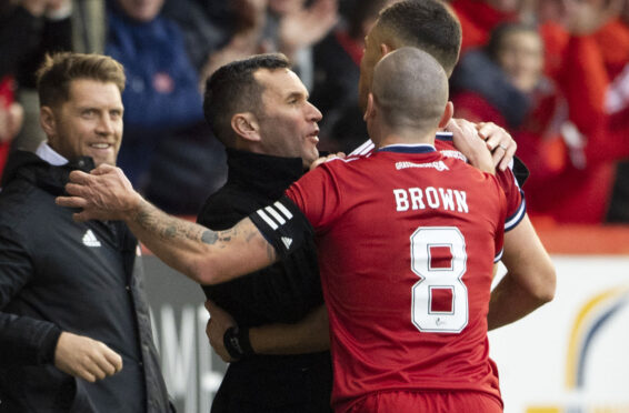 Stephen Glass and Scott Brown celebrate with Christian Ramirez after he put Aberdeen ahead yesterday