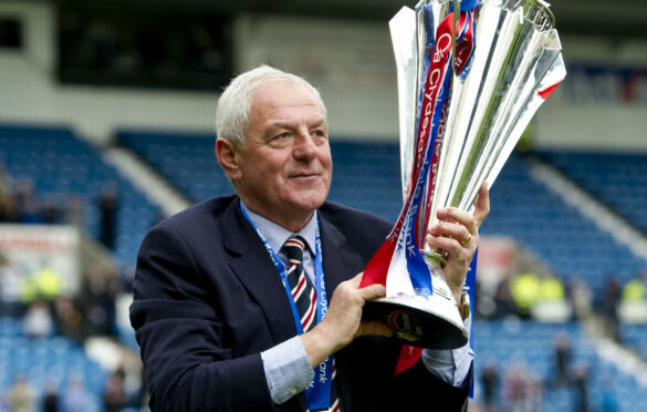 Rangers boss Walter Smith celebrates with the league trophy in 2011