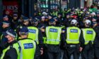 Over 100 Met officers outside a hotel in Glasgow having arrived to help police Cop26