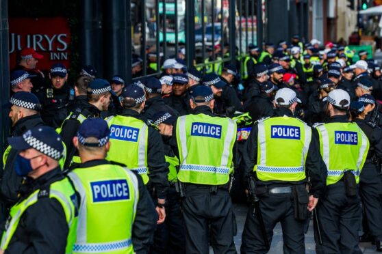 Over 100 Met officers outside a hotel in Glasgow having arrived to help police Cop26