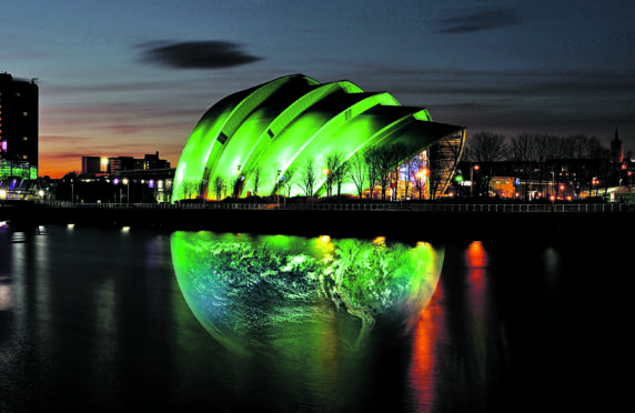 The earth is reflected in the River Clyde at the SEC in Glasgow where Cop26 begins today as the world acts to slow climate change and halt global warming