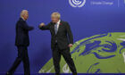 Prime Minister Boris Johnson (right) greets US President Joe Biden at the Cop26 summit.