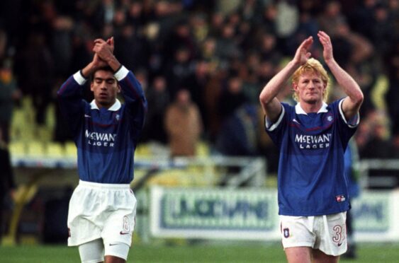 Colin Hendry with Giovanni van Bronckhorst after Rangers lost to Parma in the UEFA Cup in 1999