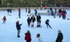 Children play and sit on the sculpture in the middle of the duck pond at Queen’s Park, Glasgow earlier this year